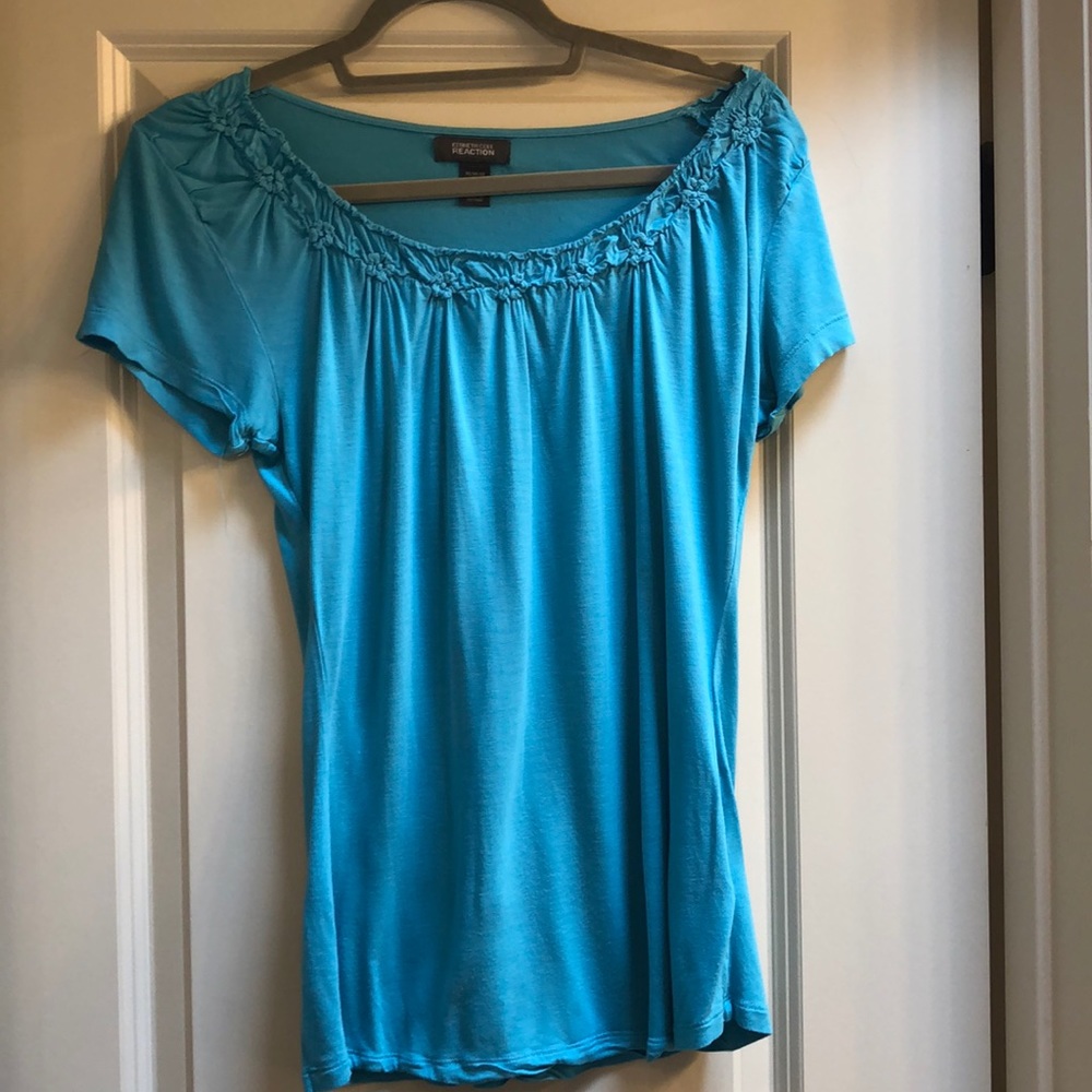 Blue shirt with floral embellishments